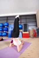 health club women doing stretching and aerobics photo
