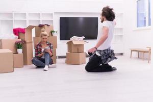 young couple moving  in new house photo