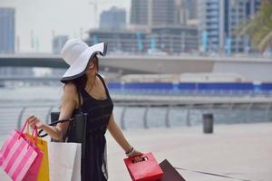 beautiful woman goes in shopping photo