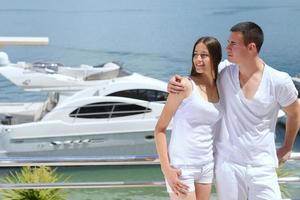 young couple on yacht photo