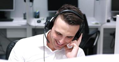 male call centre operator doing his job photo