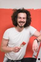 man with funny hair over color background with brush photo