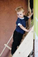 beautiful young child making first steps photo