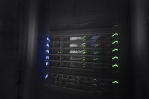 server room or data center supercomputer technology equipment, abstract close up of a server rack with motion blur. photo