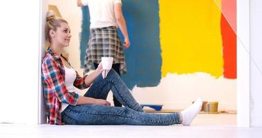 young couple doing home renovations photo