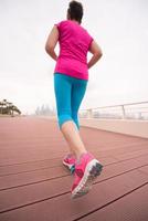 woman running on the promenade photo