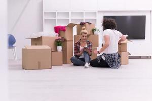 young couple moving  in new house photo