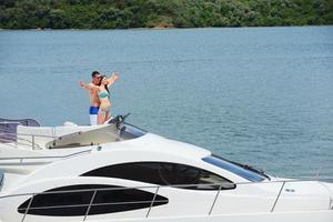 young couple on yacht photo