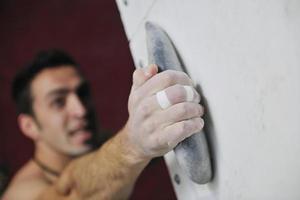 Man rock climbing photo