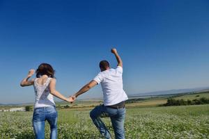 happy couple in wheat field photo