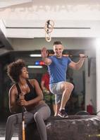 multiethnic couple after workout with hammer photo