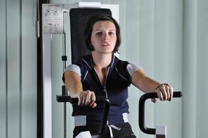 young  woman work out in fitness photo