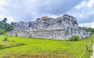 Ancient Tulum ruins Mayan site temple pyramids artifacts seascape Mexico. photo