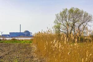 Atomic nuclear power station wadden sea tidelands coast landscape Germany. photo