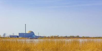 Atomic nuclear power station wadden sea tidelands coast landscape Germany. photo