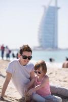 Mom and daughter on the beach photo