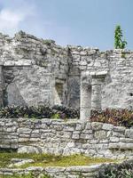 Ancient Tulum ruins Mayan site temple pyramids artifacts seascape Mexico. photo