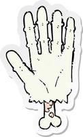 distressed sticker of a cartoon zombie hand vector