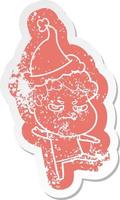 cartoon distressed sticker of a angry man wearing santa hat vector