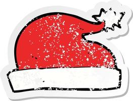 retro distressed sticker of a cartoon santa hat vector