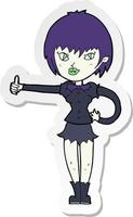 sticker of a cartoon vampire girl giving thumbs up sign vector