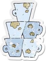 retro distressed sticker of a cartoon stack of dirty coffee cups vector