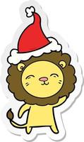 sticker cartoon of a lion wearing santa hat vector