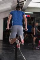 man doing exercises parallel bars photo