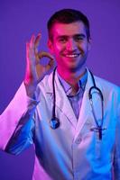 Doctor doing ok sign with fingers photo