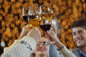 Hands holding the glasses of champagne and wine photo