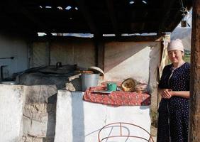 Cholpon Ata, Issyk-Kul, Kyrgyzstan, 2019 - Woman selling fresh bread in her small store in Cholpon Ata, Kyrgyzstan photo