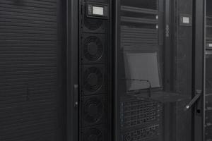 Data Center With Multiple Rows of Fully Operational Server Racks. Modern Telecommunications, Cloud Computing, Artificial Intelligence, Database, Supercomputer Technology Concept. photo