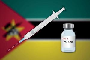 Syringe and vaccine vial on blur background with Mozambique flag vector