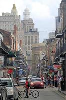 New Orleans, Louisiana, USA, 2020 - Street scene in the French Quarter of New Orleans, Louisiana, with the higher downtown buildings in the background. photo