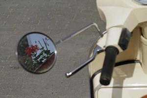 Spring time - flowers in moped mirror photo