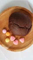 Dark brown bread and six cute candies photo