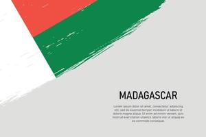 Fondo de trazo de pincel de estilo grunge con bandera de madagascar vector