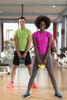 couple  workout with weights at  crossfit gym photo