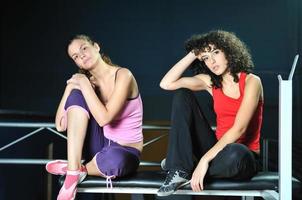two women work out  in fitness club photo