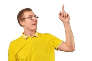 Funny young guy in corrective glasses and yellow T-shirt with eureka gesture, man got idea isolated photo