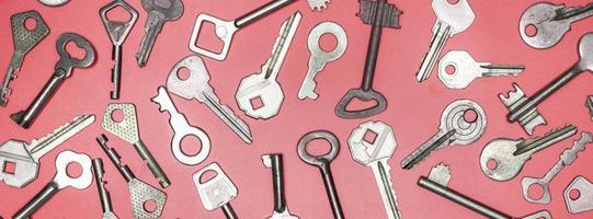 Keys set on pink background. Door lock keys and safes for proper photo