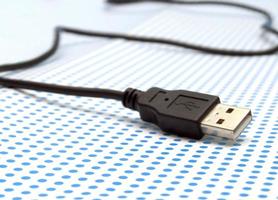 USB cable on dotted background photo