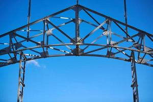 Frame of goods shed. Metal construction of railway building. Old abandoned steel warehouse for goods. photo