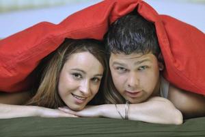 young couple in bed photo