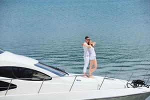 young couple on yacht photo