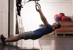 man doing dipping exercise photo