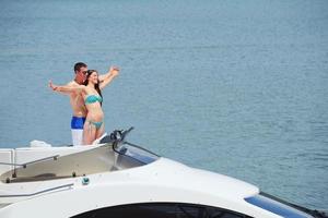 young couple on yacht photo