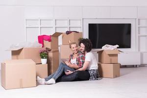 young couple moving  in new house photo