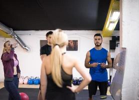 athletes getting instructions from trainer photo