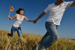 happy couple in wheat field photo